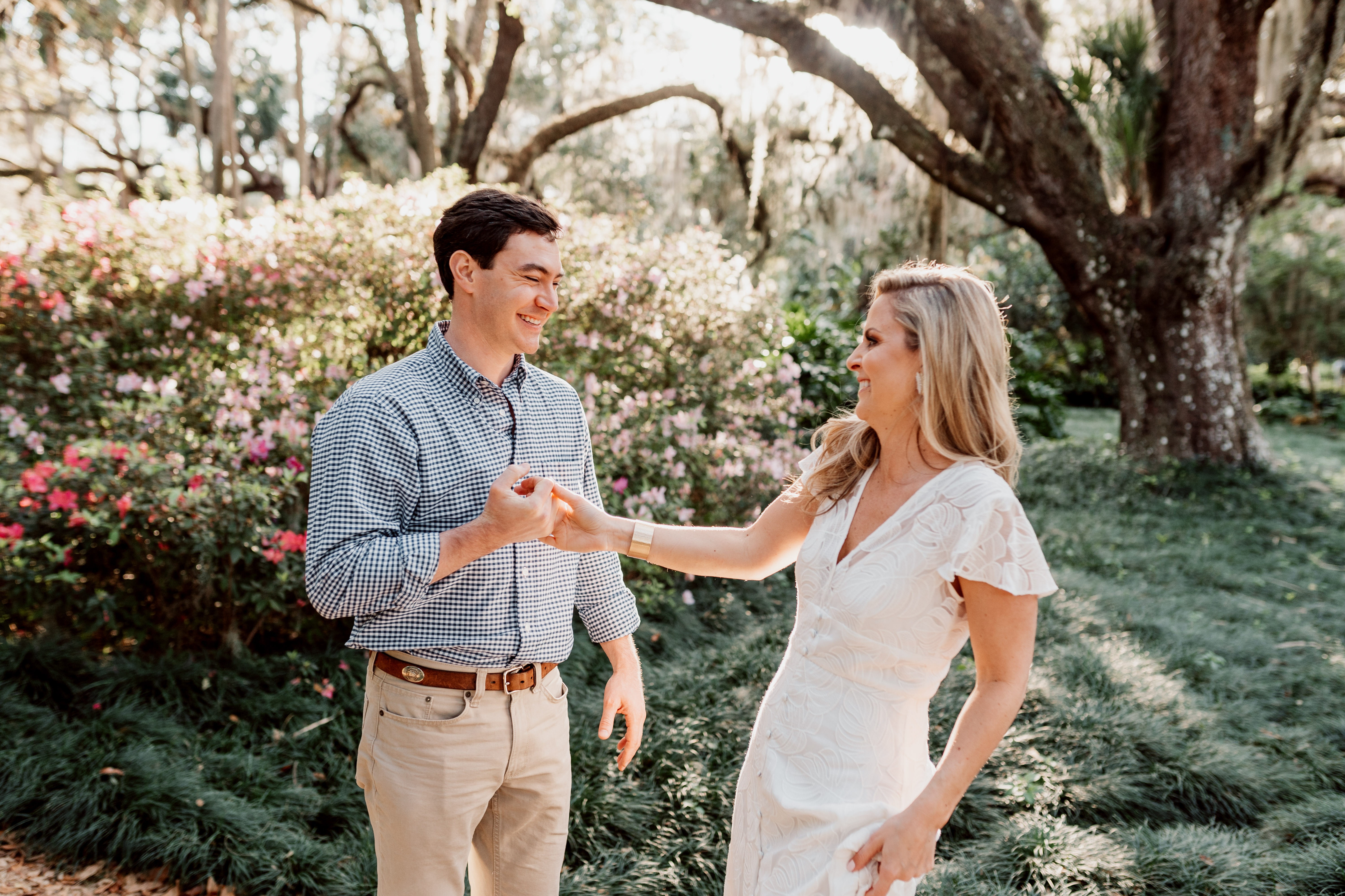 engaged couple laughing in washington oaks state park